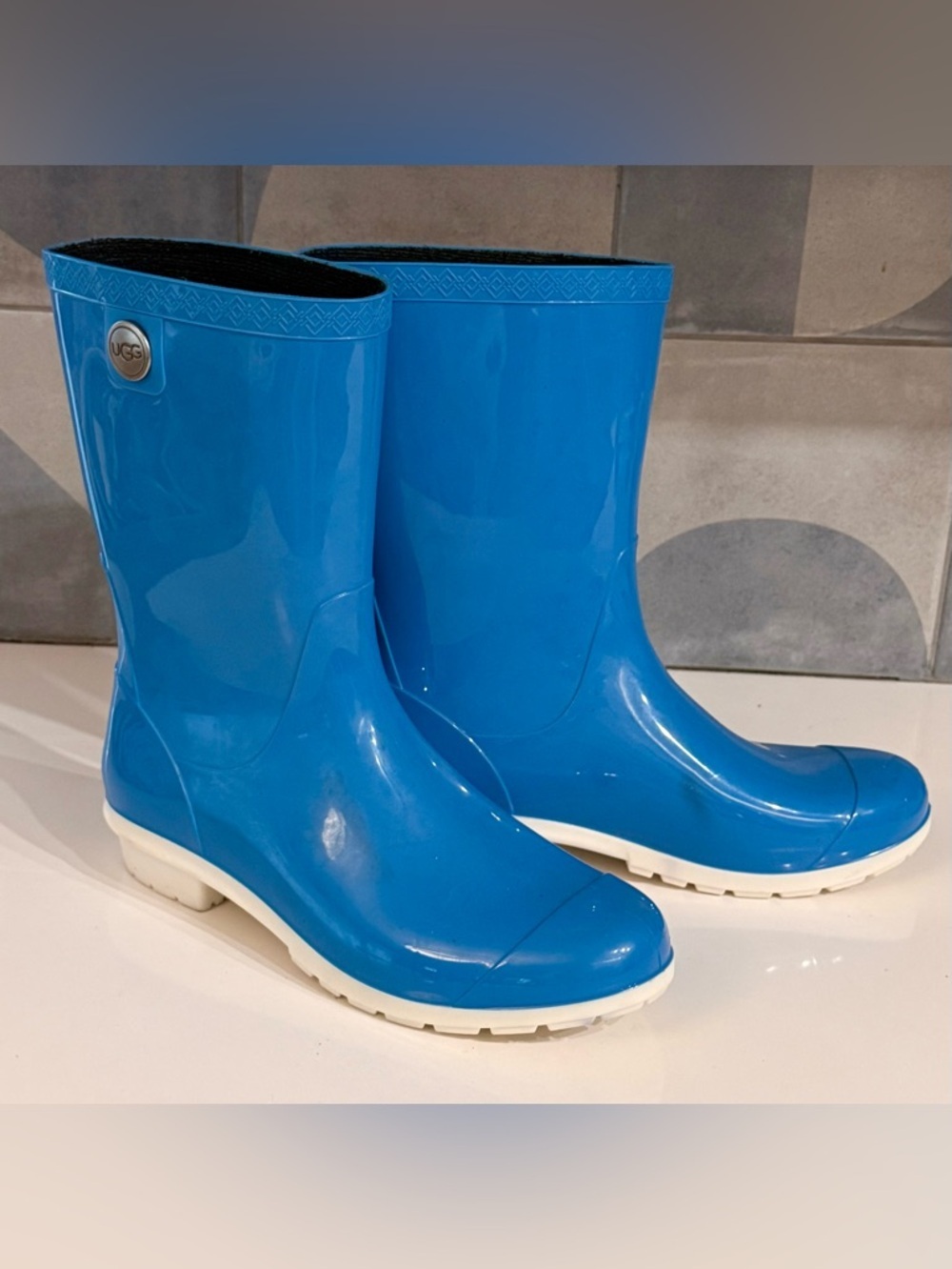 UGG cobalt blue rubber rain boots. White sole, silver tone button- 9